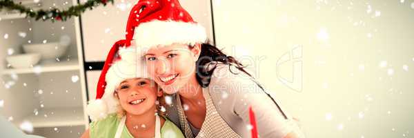 Composite image of portrait of a cute girl with her mother baking christmas cookies