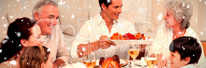 Composite image of family having a big dinner at home