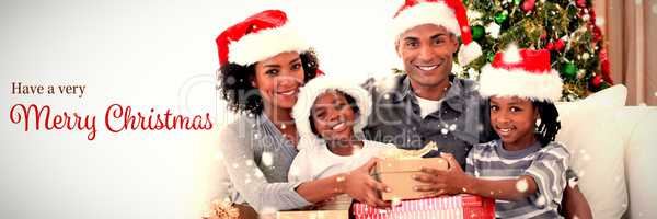 Composite image of smiling family sharing christmas presents