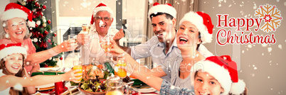 Composite image of family in santas hats toasting wine glasses at dining table