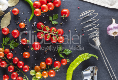 Ripe red cherry tomatoes, chili and spices