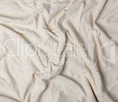 crumpled cotton fabric of beige color