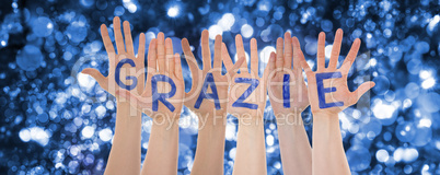 Hands Building Grazie Means Thank You, Sparkling Bokeh Background