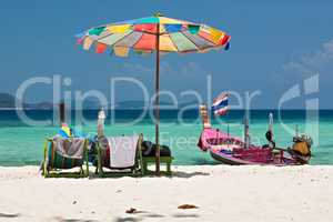 Beach umbrella and chairs in Coral island, Thailand