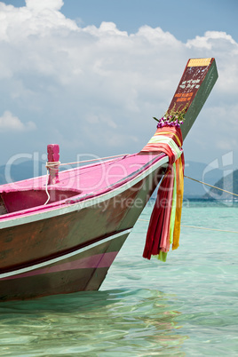 Bow of a Thai boat with colored scarfs