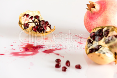 Half pomegranate and seeds