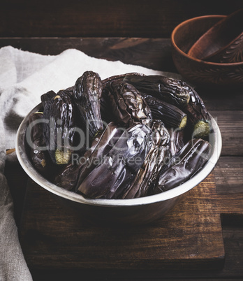 boiled eggplants in an iron bowl, top view