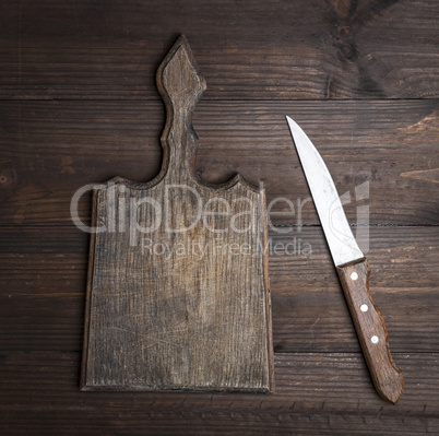 very old empty kitchen brown cutting board with handle
