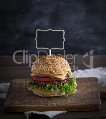 hamburger with meat patty and fresh vegetables