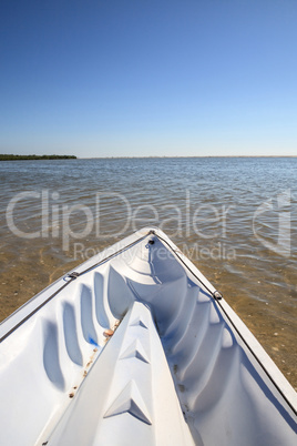 Kayak glides through water along the coastline of Marco Island,