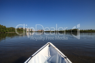 Kayak glides through water along the coastline of Marco Island,