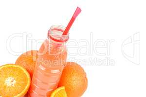 A fruit of orange and a bottle with juice isolated on white back