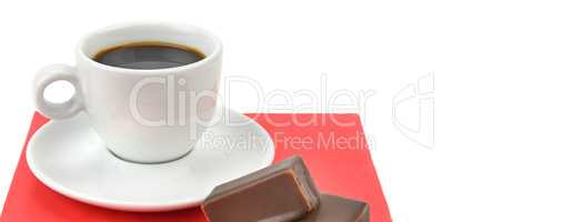 cup of coffee and chocolate candy isolated on white background .