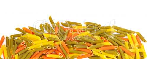 Colored dry macaroni isolated on white background. Wide photo.