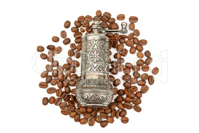 Coffee grinder and roasted coffee beans isolated on white backgr