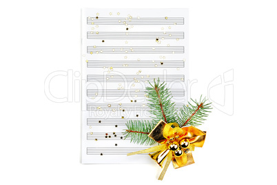 Christmas decorations on music sheets, closeup