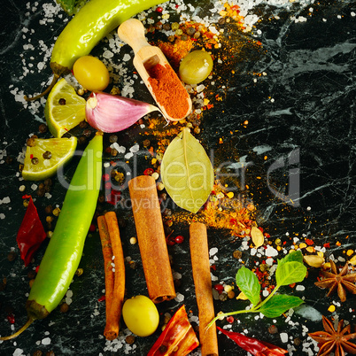 Variety of spices and herb on kitchen table.