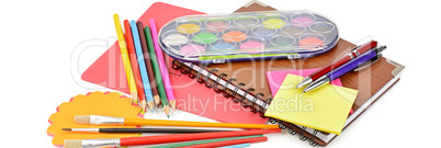 Pencils, paints, notebooks and other stationery isolated on a wh