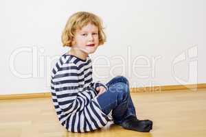 Child sitting on the floor