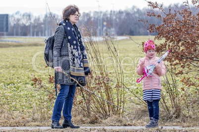 Woman with child on walk