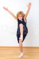Girl is balancing on one leg