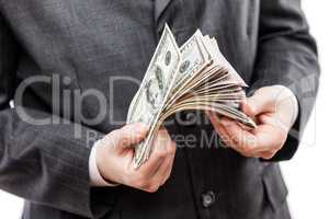 Businessman in black suit hand holding US dollar currency money