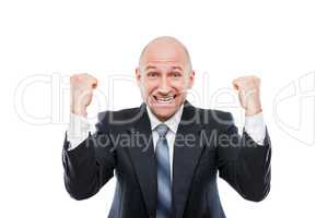 Smiling businessman winner gesturing raised hands fist celebrating victory
