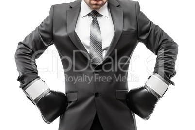Businessman boxer in black suit wearing sport boxing gloves