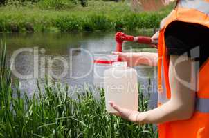 Take samples of water for laboratory testing. The concept - analysis of water purity, environment, ecology.