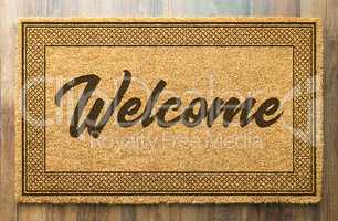 Welcome Mat On A Wood Floor Background