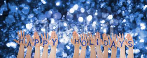 Many Hands Building Word Happy Holidays, Sparkling Bokeh Background