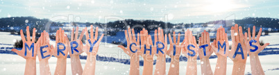 Many Hands Building Word Merry Christmas, Winter Scenery As Background
