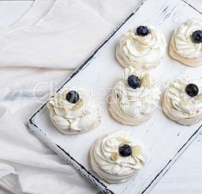 baked round meringues with whipped cream