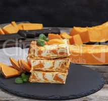 pumpkin cheesecake on black surface