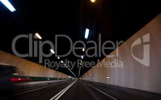 Motion Blur Driving Car at Speed Through a Tunnel
