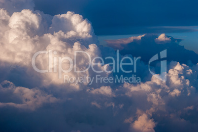 top view of the clouds and the blue sky from the plane window, the background of nature.