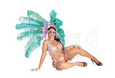 Woman sitting in carnival outfit on floor