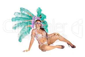 Woman sitting in carnival outfit on floor