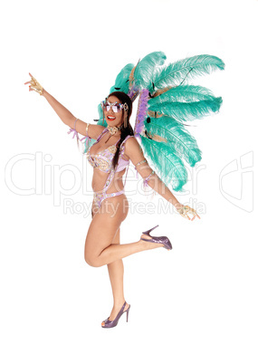 Beautiful woman in a carnival outfit standing in profile