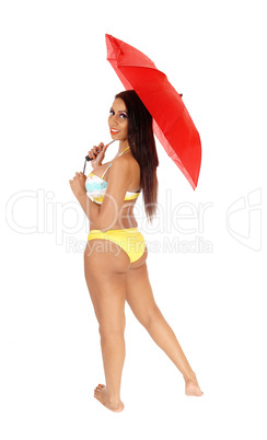 Woman standing in bikini from the back with umbrella