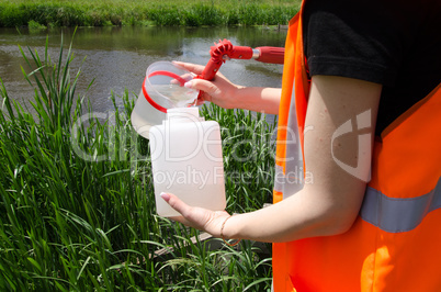 Take samples of water for laboratory testing. The concept - analysis of water purity, environment, ecology.