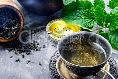 Tea with green fresh melissa leaves