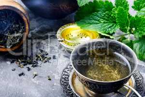 Tea with green fresh melissa leaves