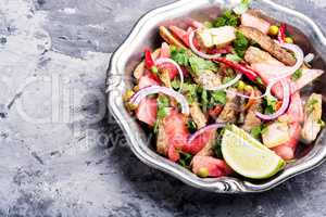 Exotic salad with meat and watermelon