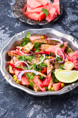 Exotic salad with meat and watermelon