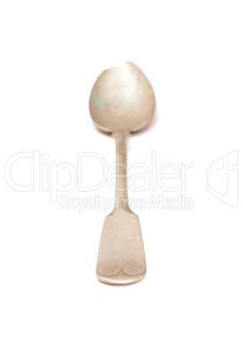 Old spoon on a white background