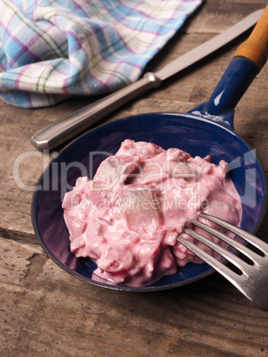 Herring with beet root sauce