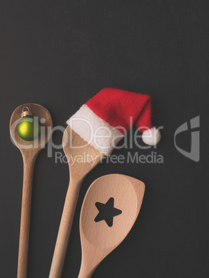 Wooden cooking spoon with hat of Santa