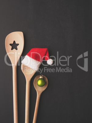 Wooden cooking spoon with hat of Santa