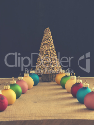 Colorful Christmas baubles with a golden tree